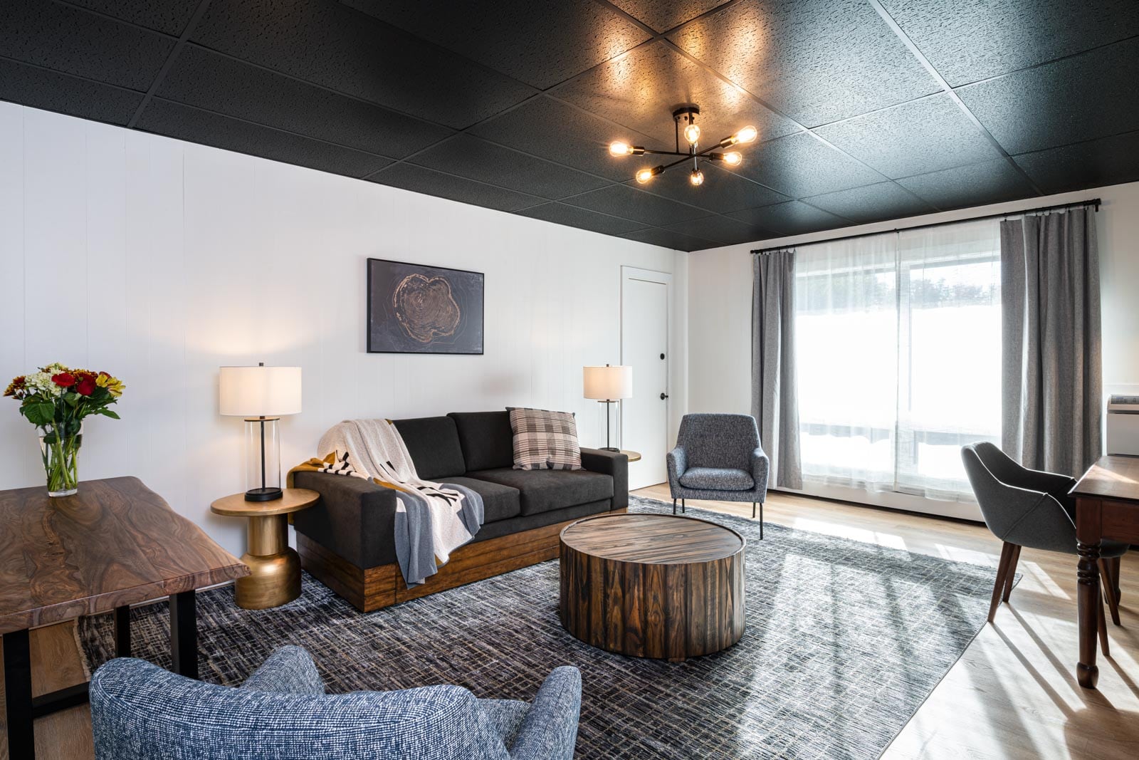 A modern and rustic hotel room.