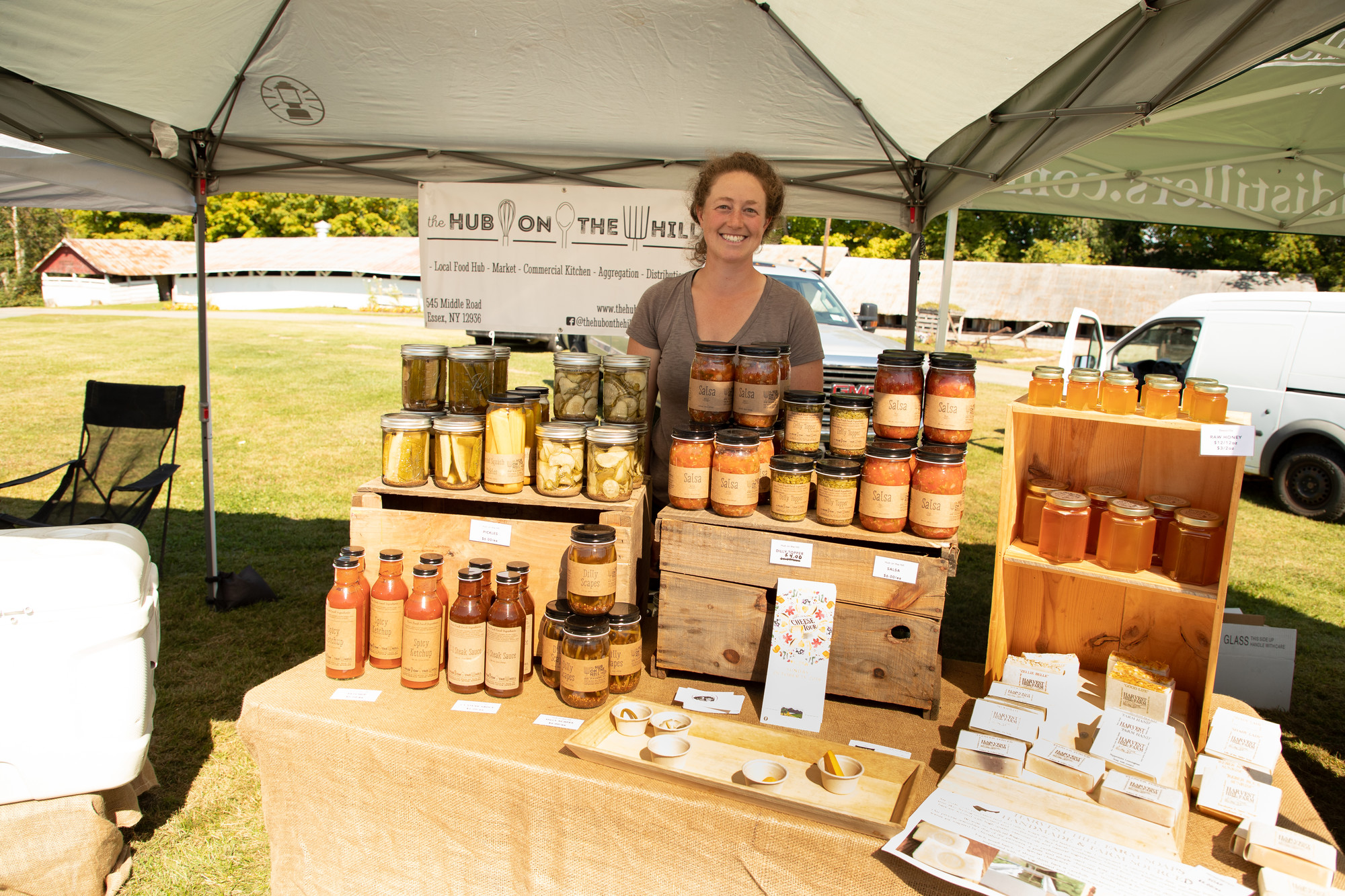 Woman selling products at the Adirondack Harvest Festival.