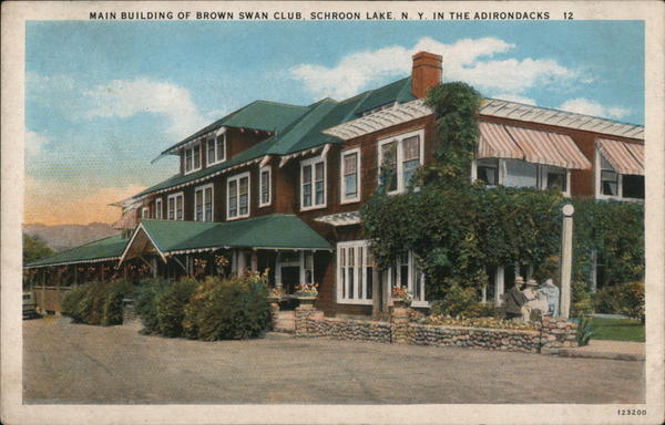 A vintage color postcard showing the Brown Swan Club, an early Adirondack hotel.