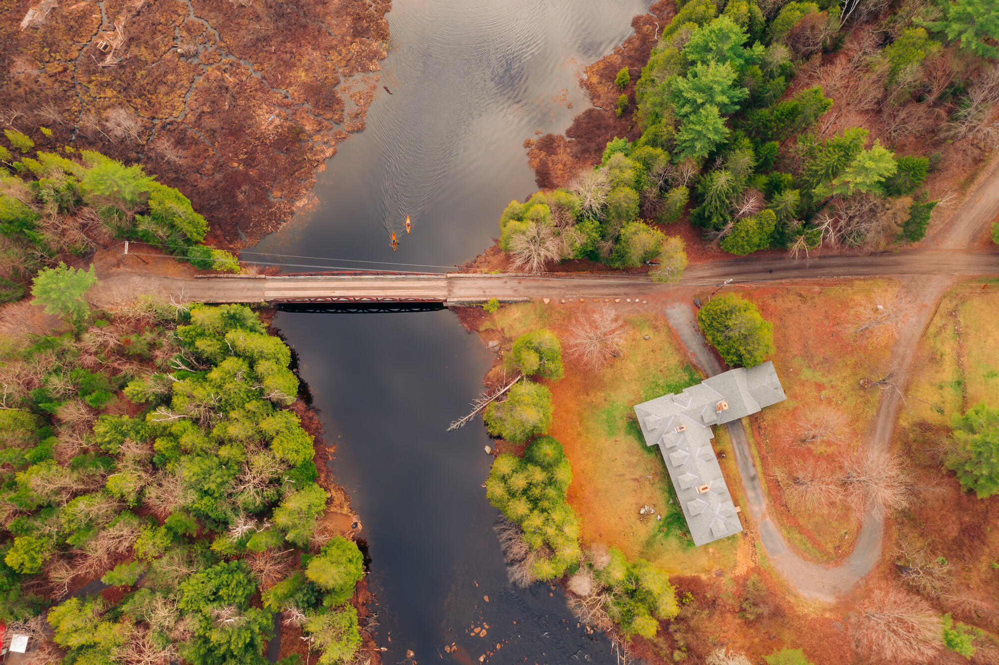 An aerial shot of two pack canoes on the water