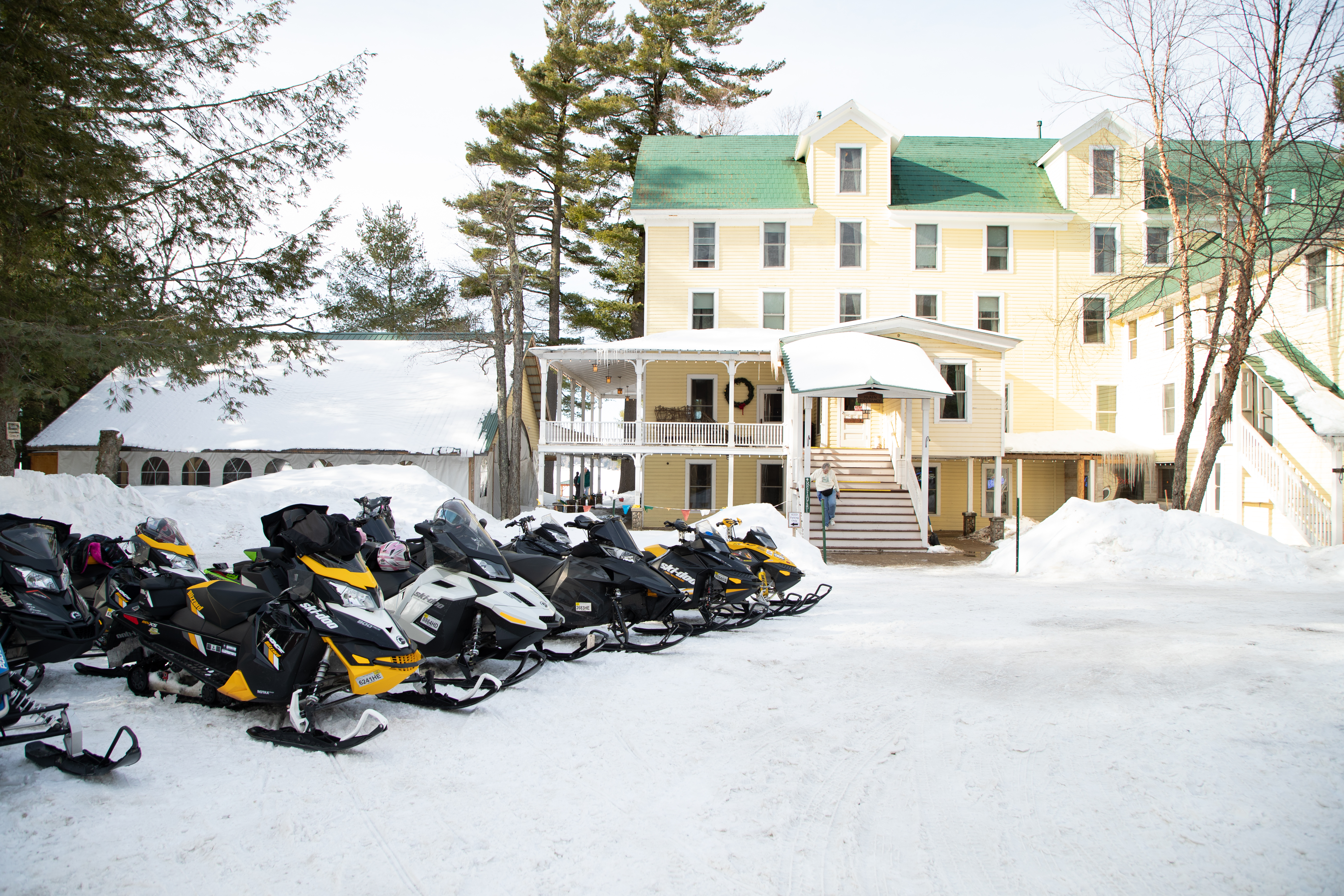 Snowmobiles outside of The Woods Inn.