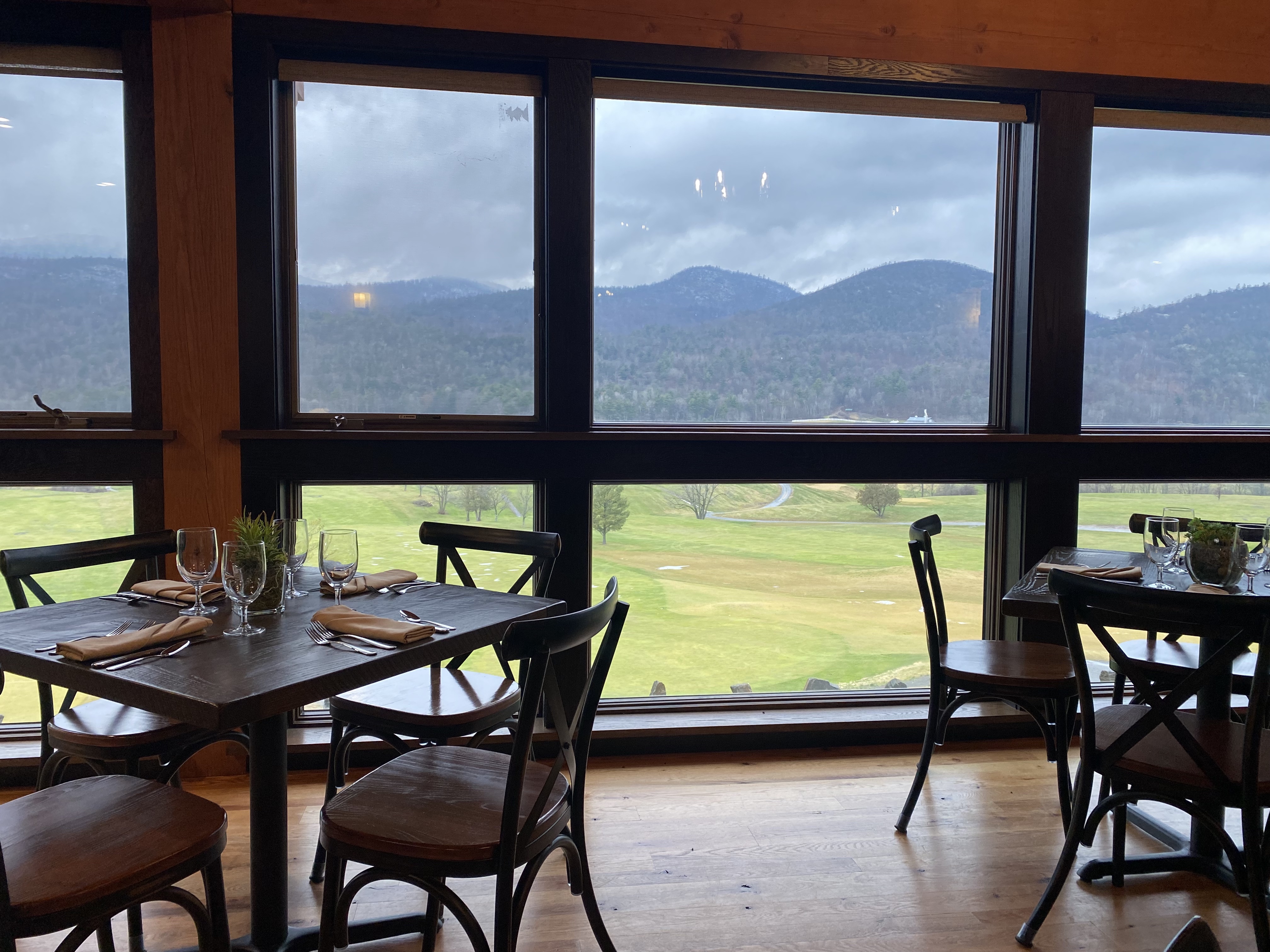 Stormy mountains out the picture windows at the back of the dining room
