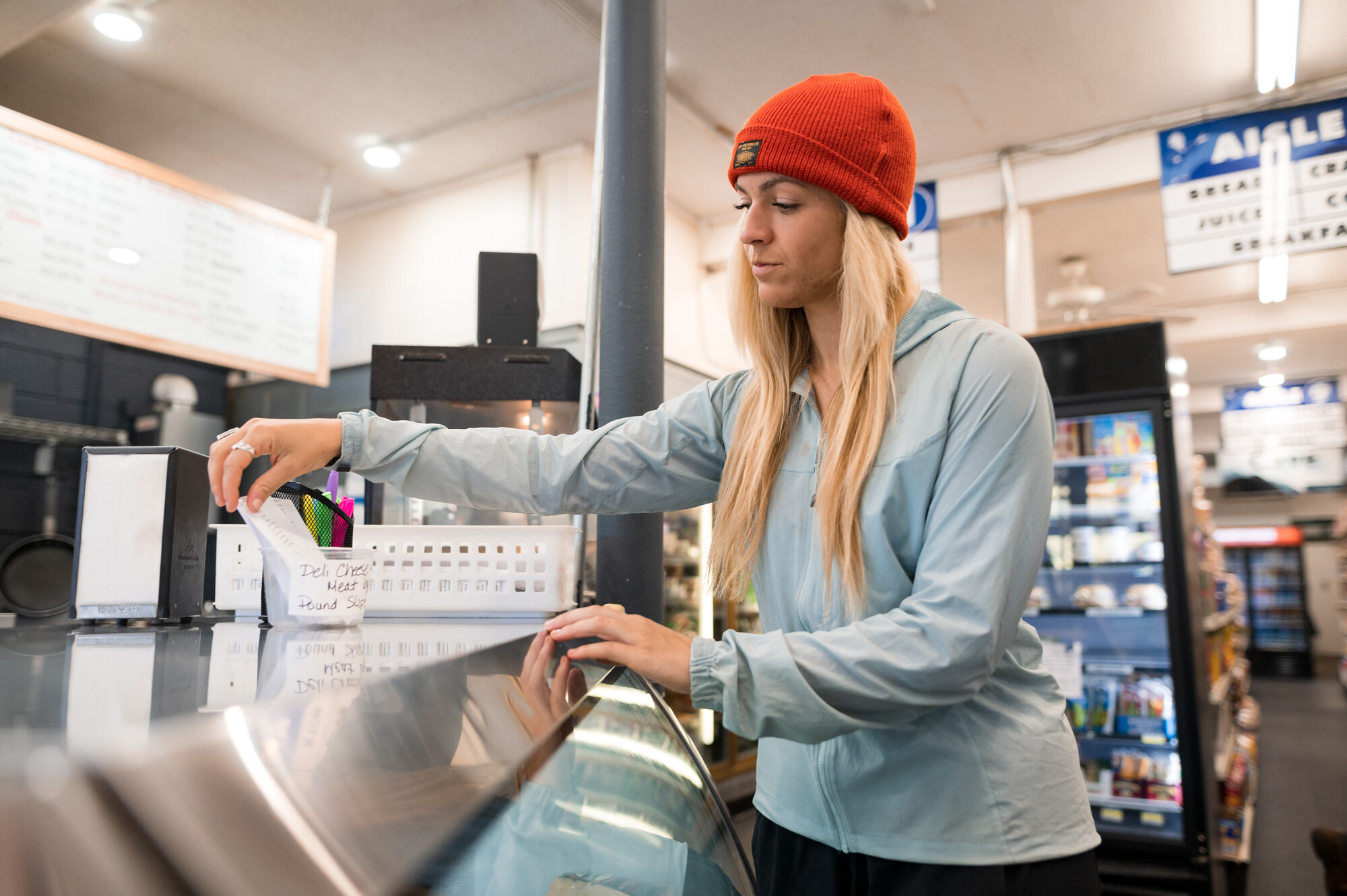 A person ordering food at the supermarket