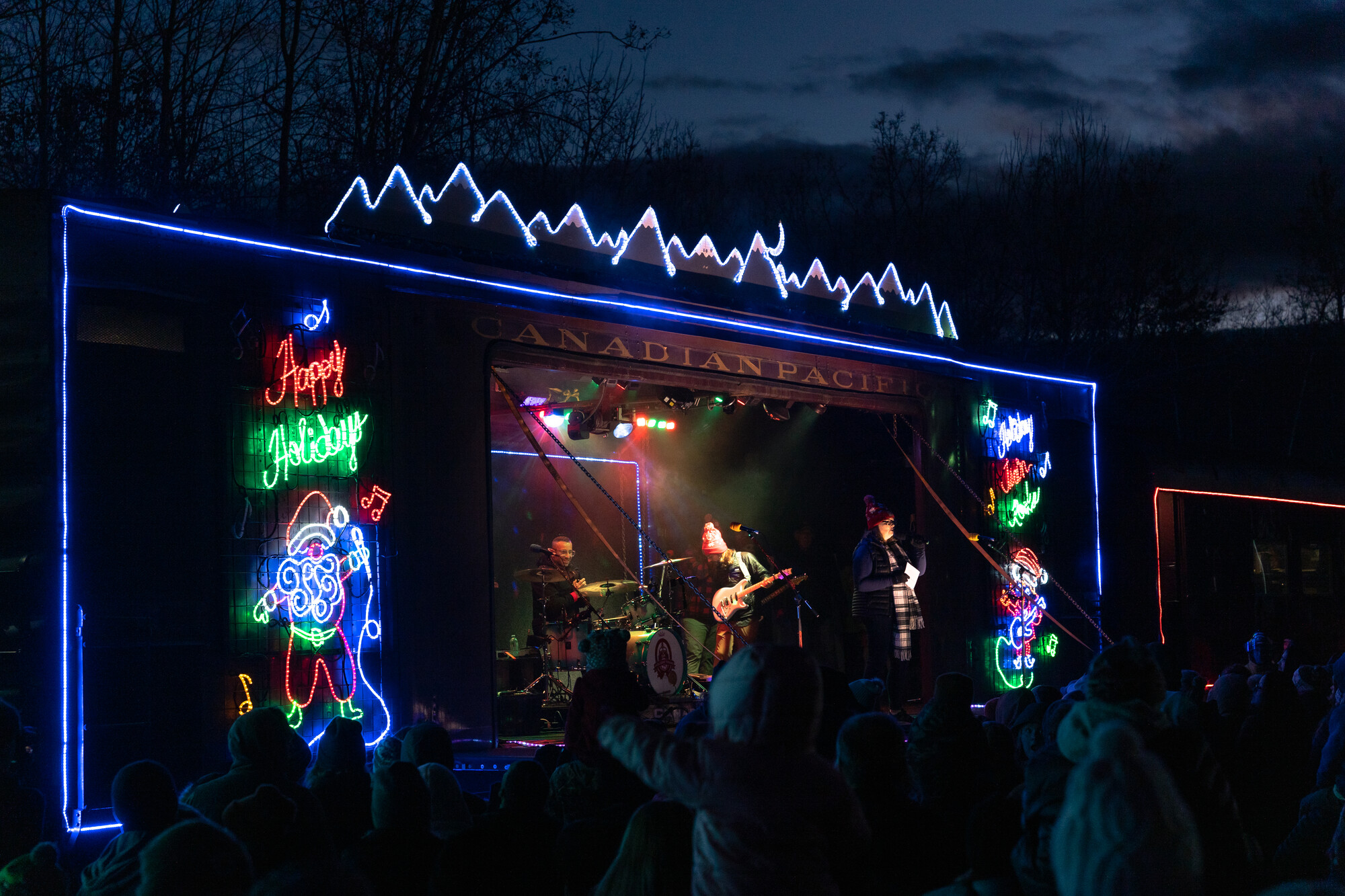 A concert in a train car on a snowy winter night. 