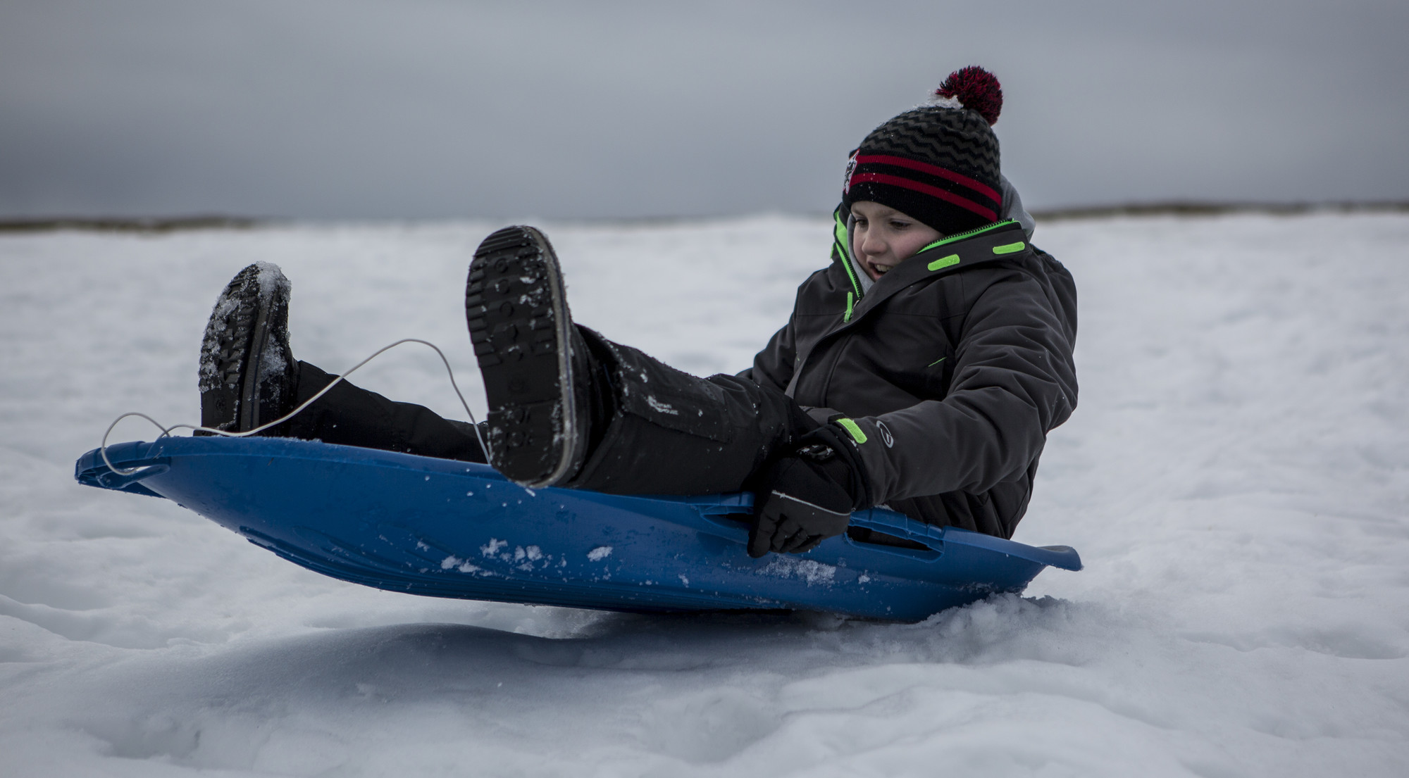 Kid sledding down the hill