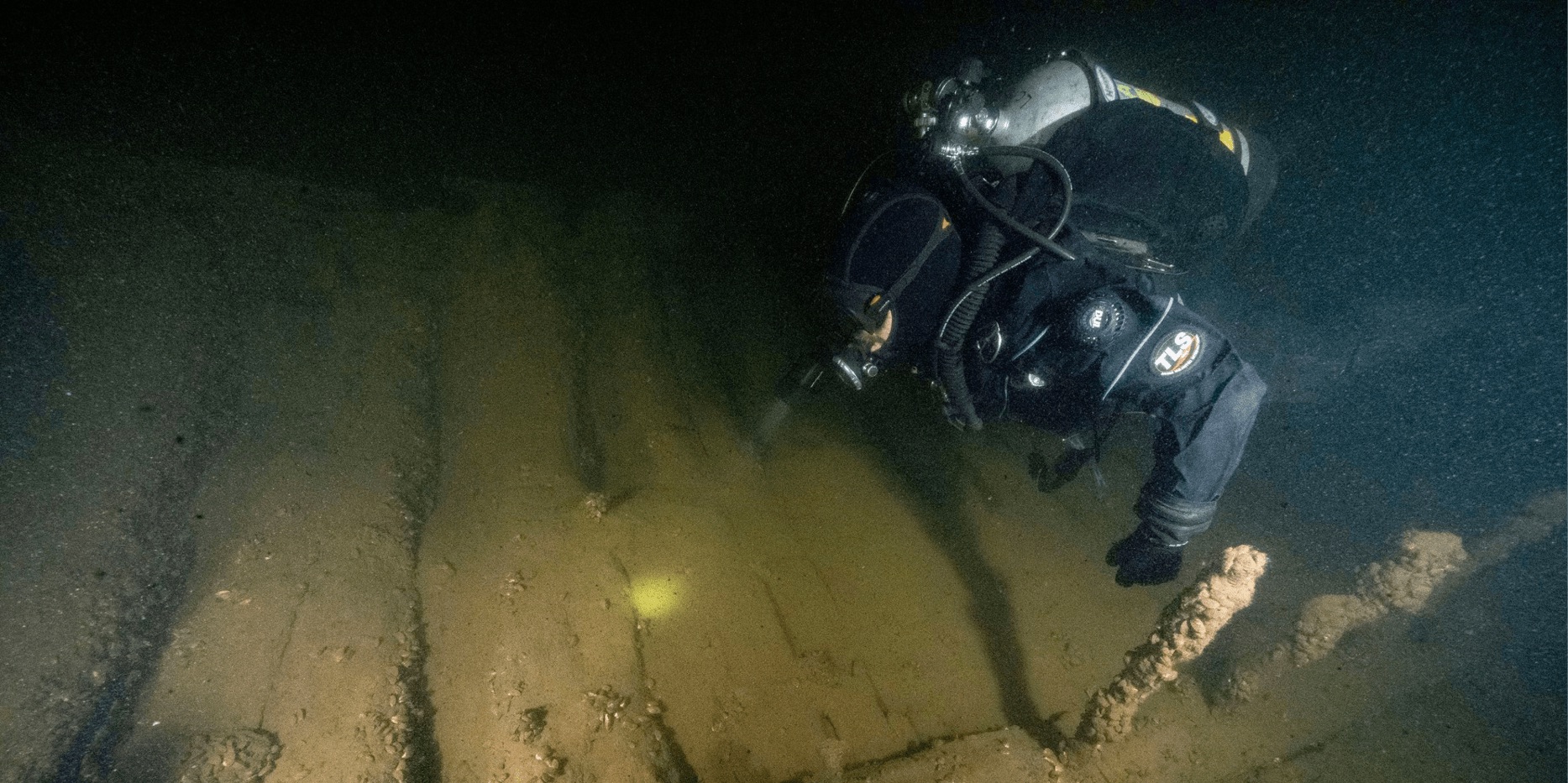 A diver explores a shipwreck underwater. Photo courtesy of Lake Champlain Maritime Museum