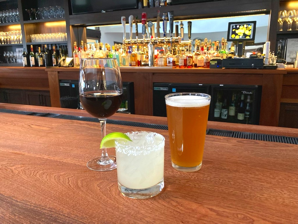 Three drinks sit on the bar at Seymour's restaurant, a part of Ticonderoga Golf Course