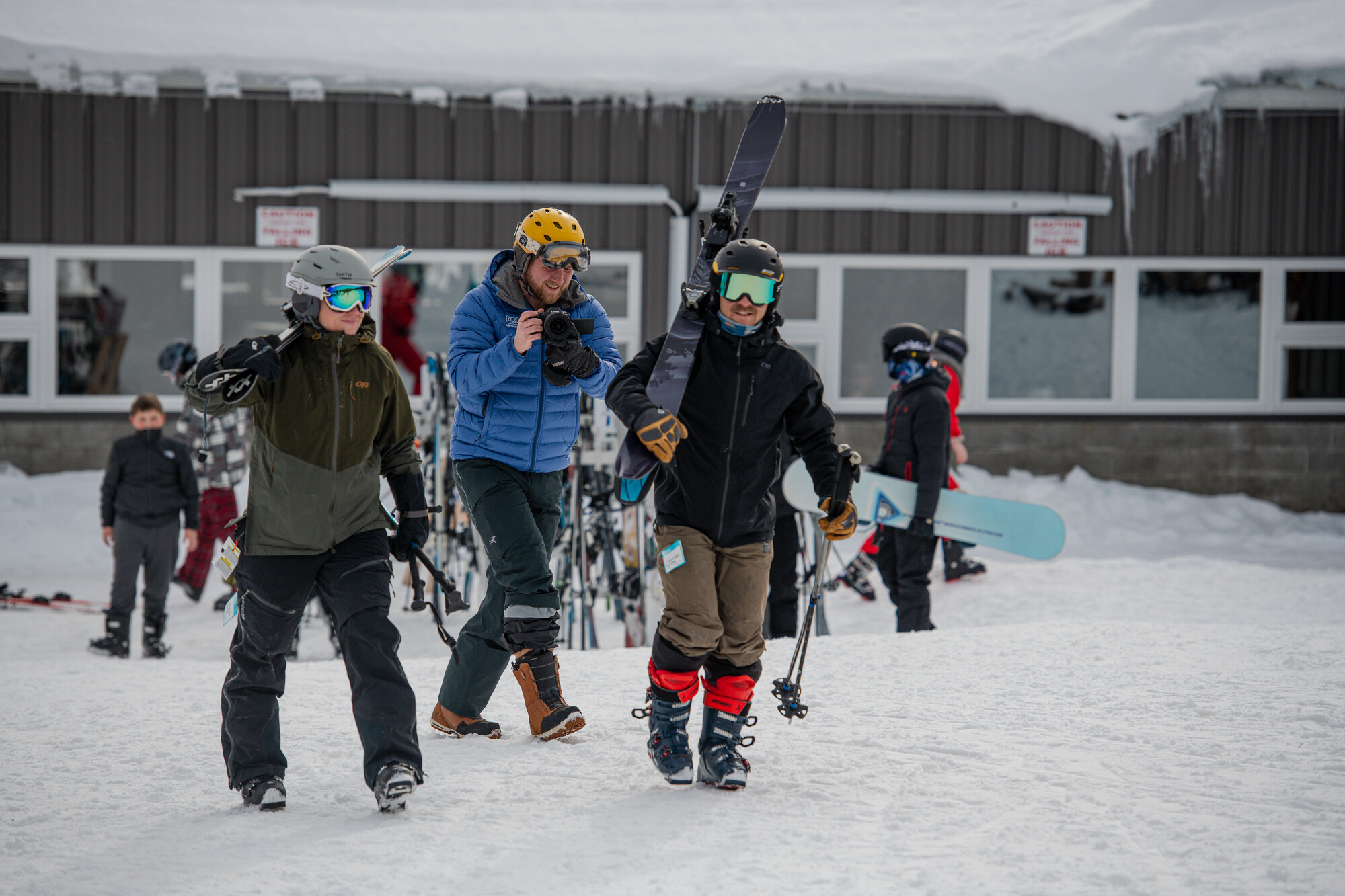 A group of skiers carries ski equipment at Oak Mountain in Speculator NY