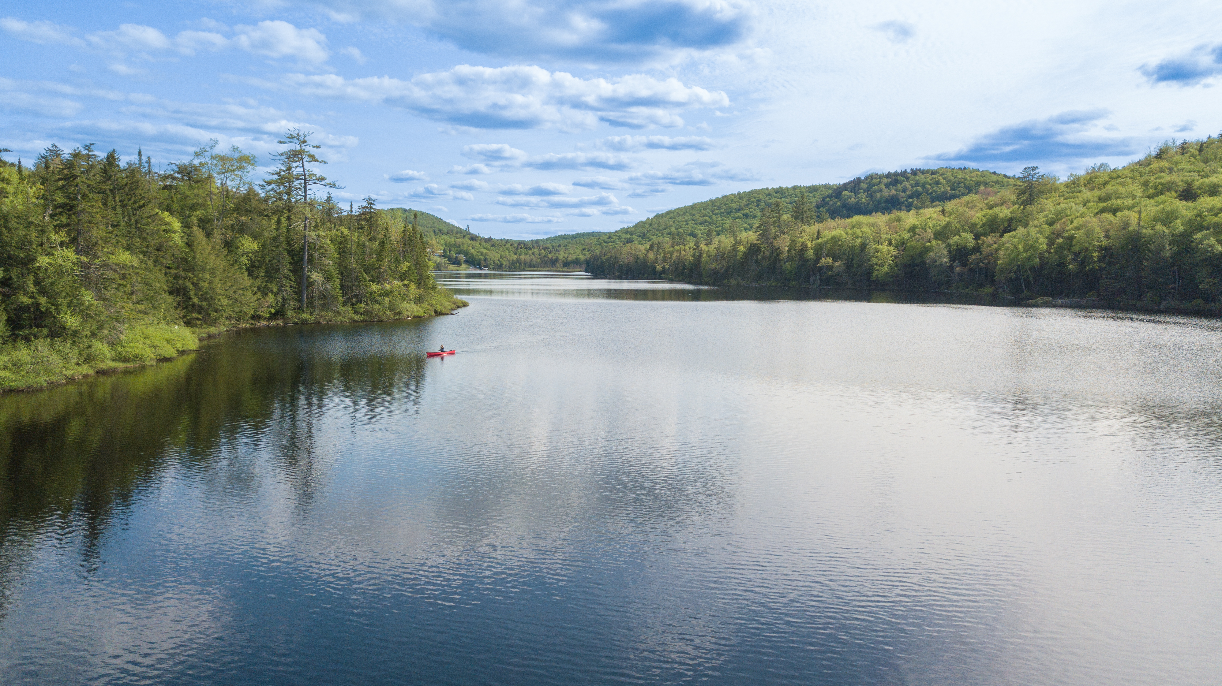 Woman paddling on Balfour Lake in Minerva NY