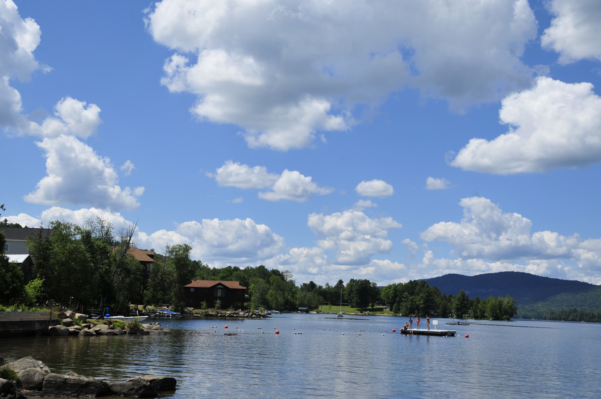 Blue Mountain Lake Beach on a sunny clear day.