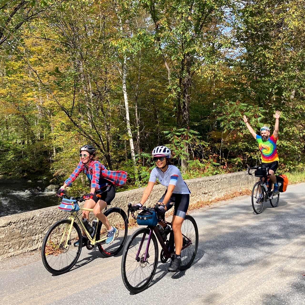 three people enjoying a bike ride