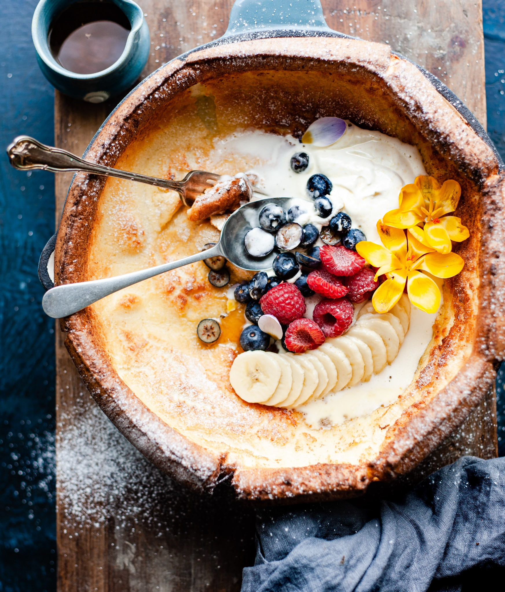 Close-up of a fruit-laden Dutch baby pancake.