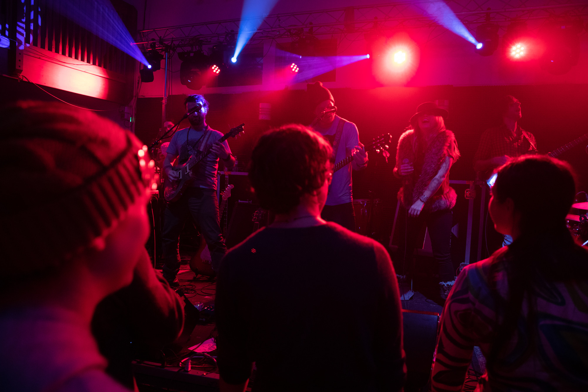 Band on stage with crowd dancing in front
