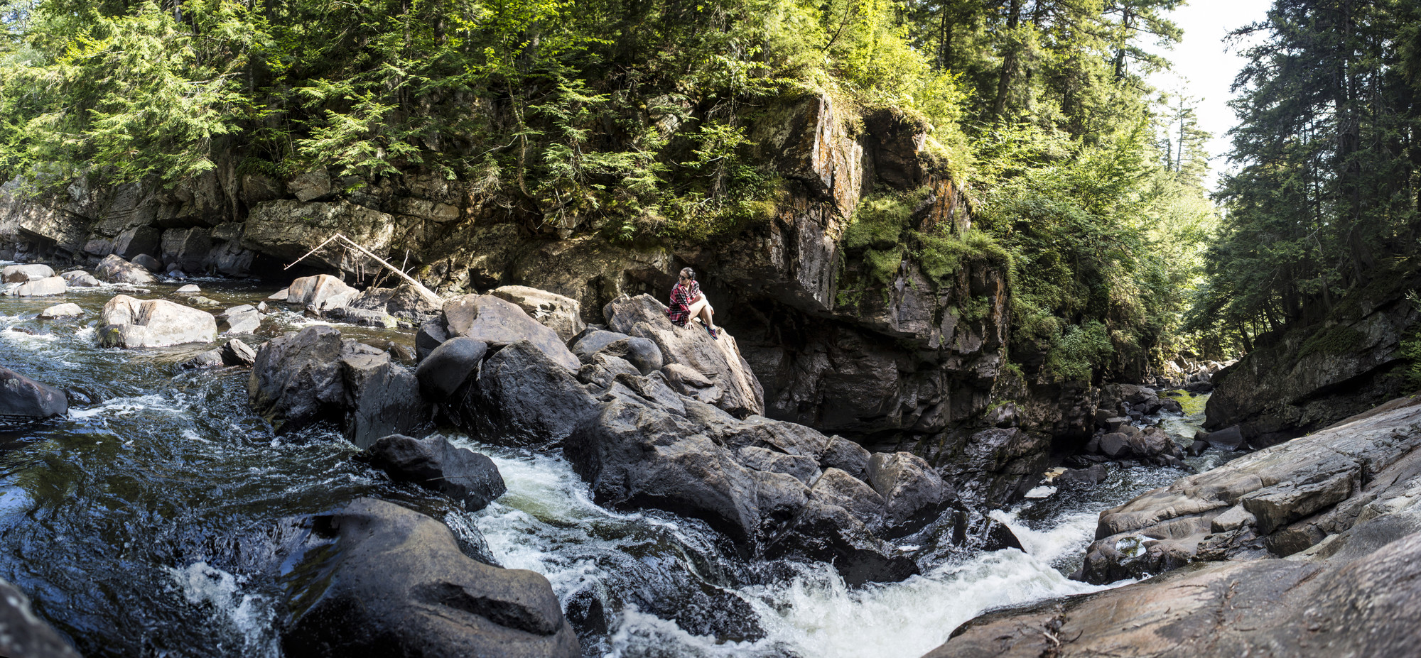 woman looking at waterfall