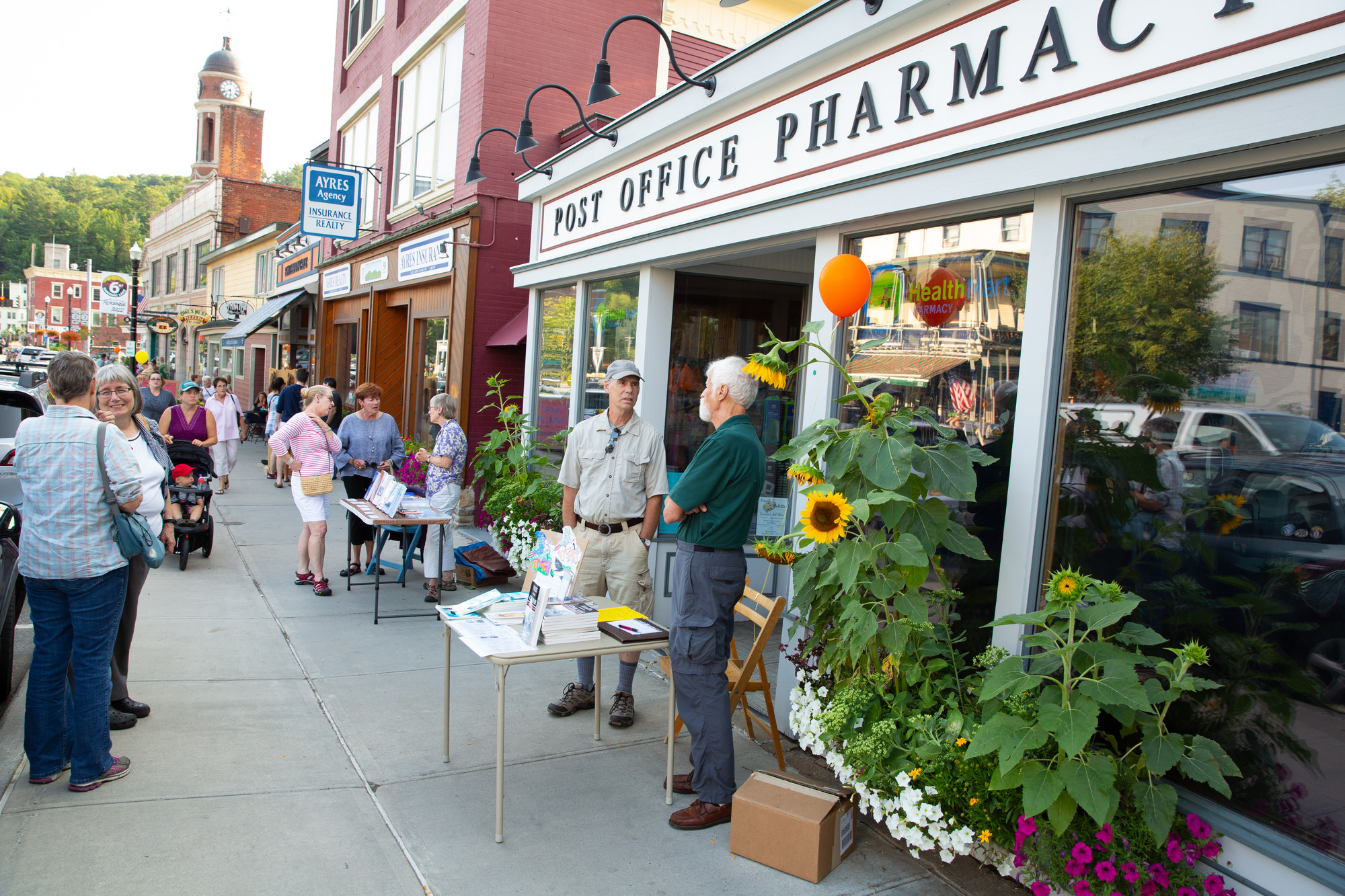 A crowded downtown main street during a Saranac Lake Art Walk