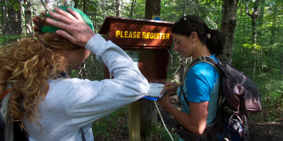 Allison signs us in at the OK Slip Falls trail head