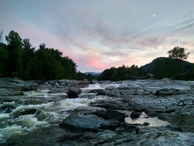 Rapids at night during sunset. 