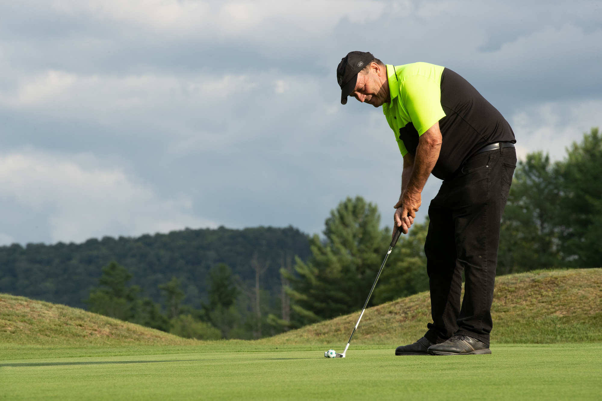 Man putting on green