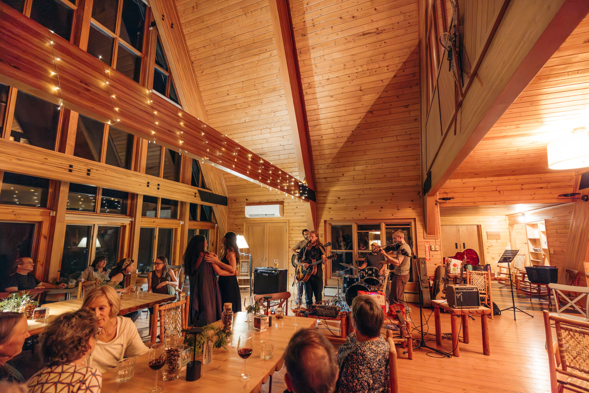 A group of people enjoy an event at New Vida Preserve
