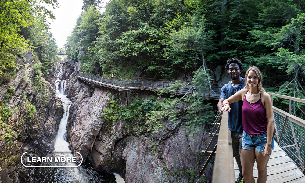 A smiling couple at High Falls Gorge.