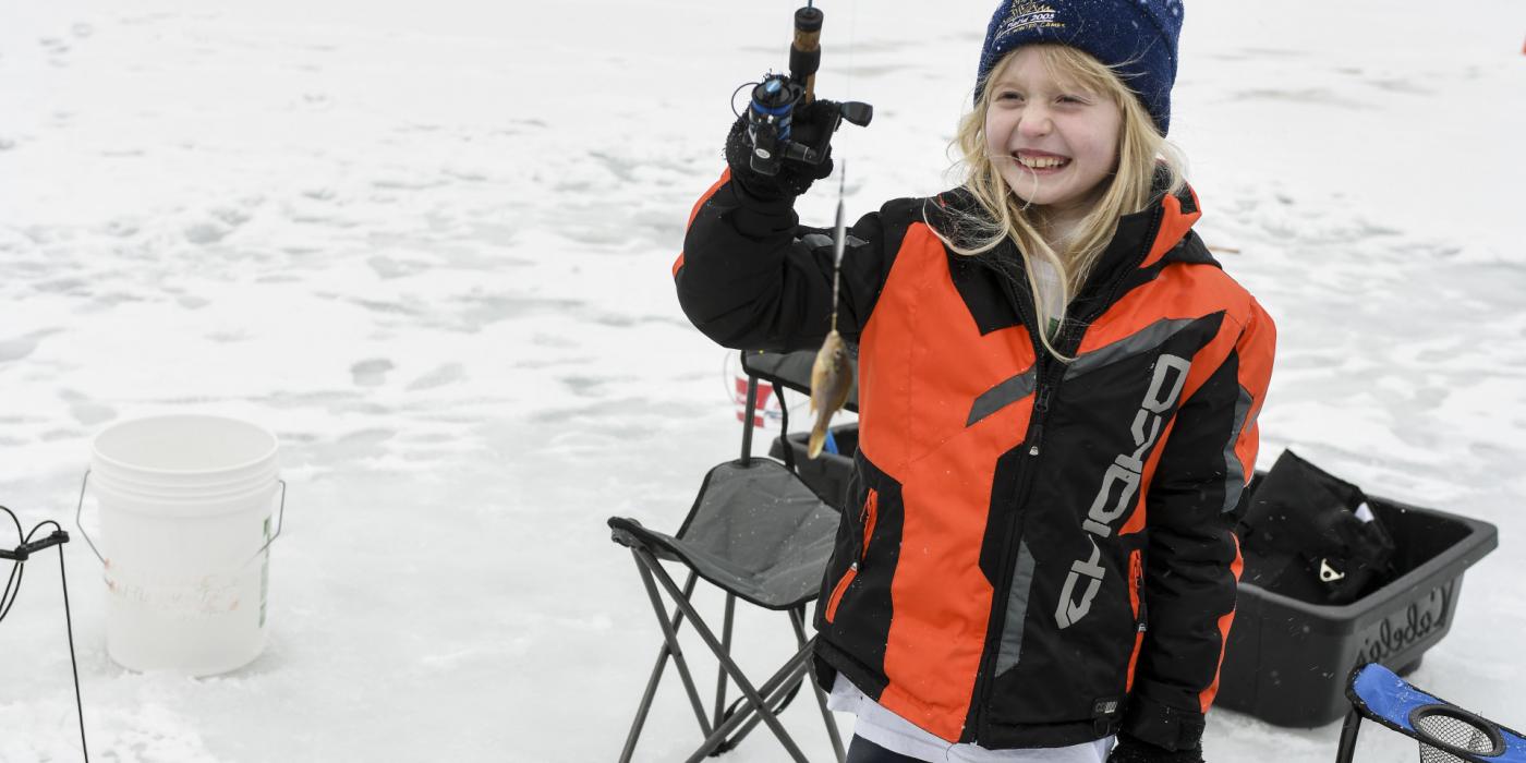 Learning to ice fish at The Wild Center