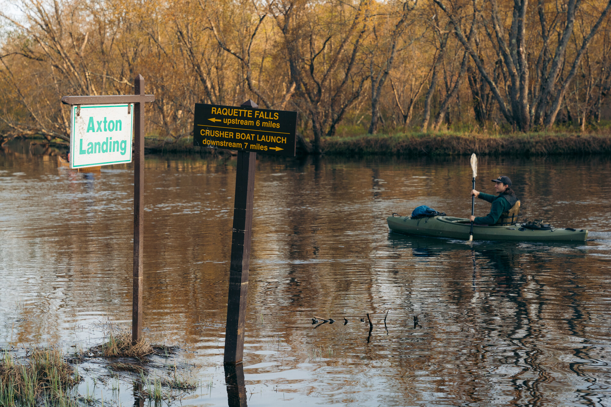A kayaker paddles upstream